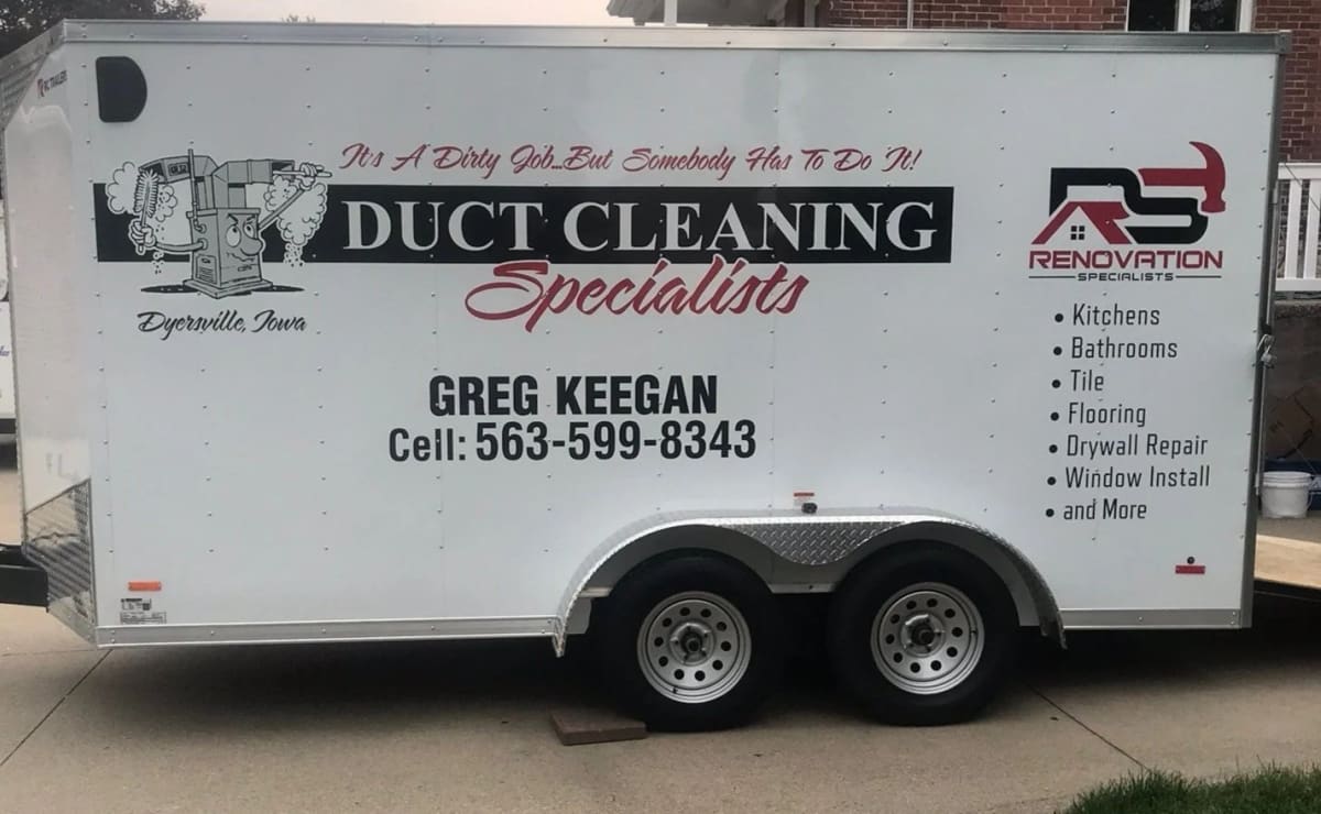 Greg Keegan's work trailer, marked with the Duct Cleaning Specialists name and phone number